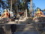 
Kathmandu Swayambhunath Two Buddha Statues At Entrance Gate
